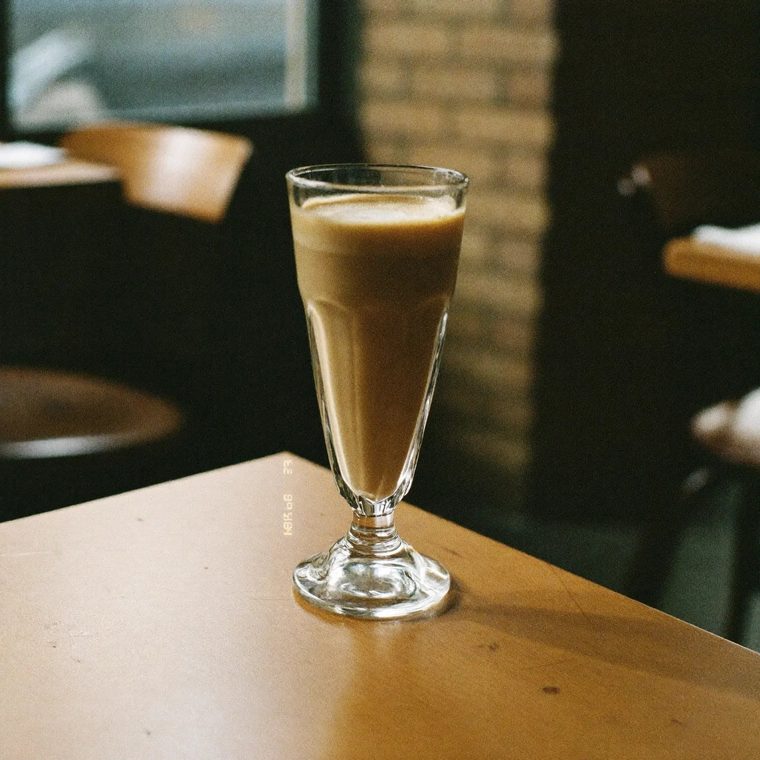 A latte in a tall glass