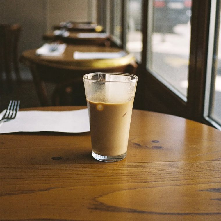An iced coffee in a tall glass