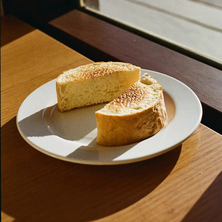 A toasted panini on a white plate